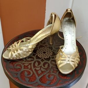 BCBG gold ankle strap heels
